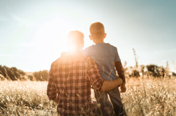 Father and son in a natural setting.