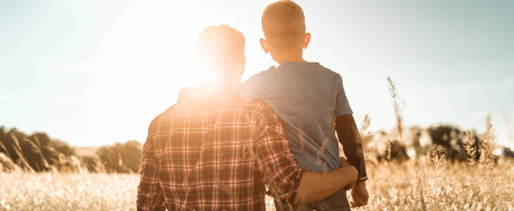 Father and son in a natural setting.